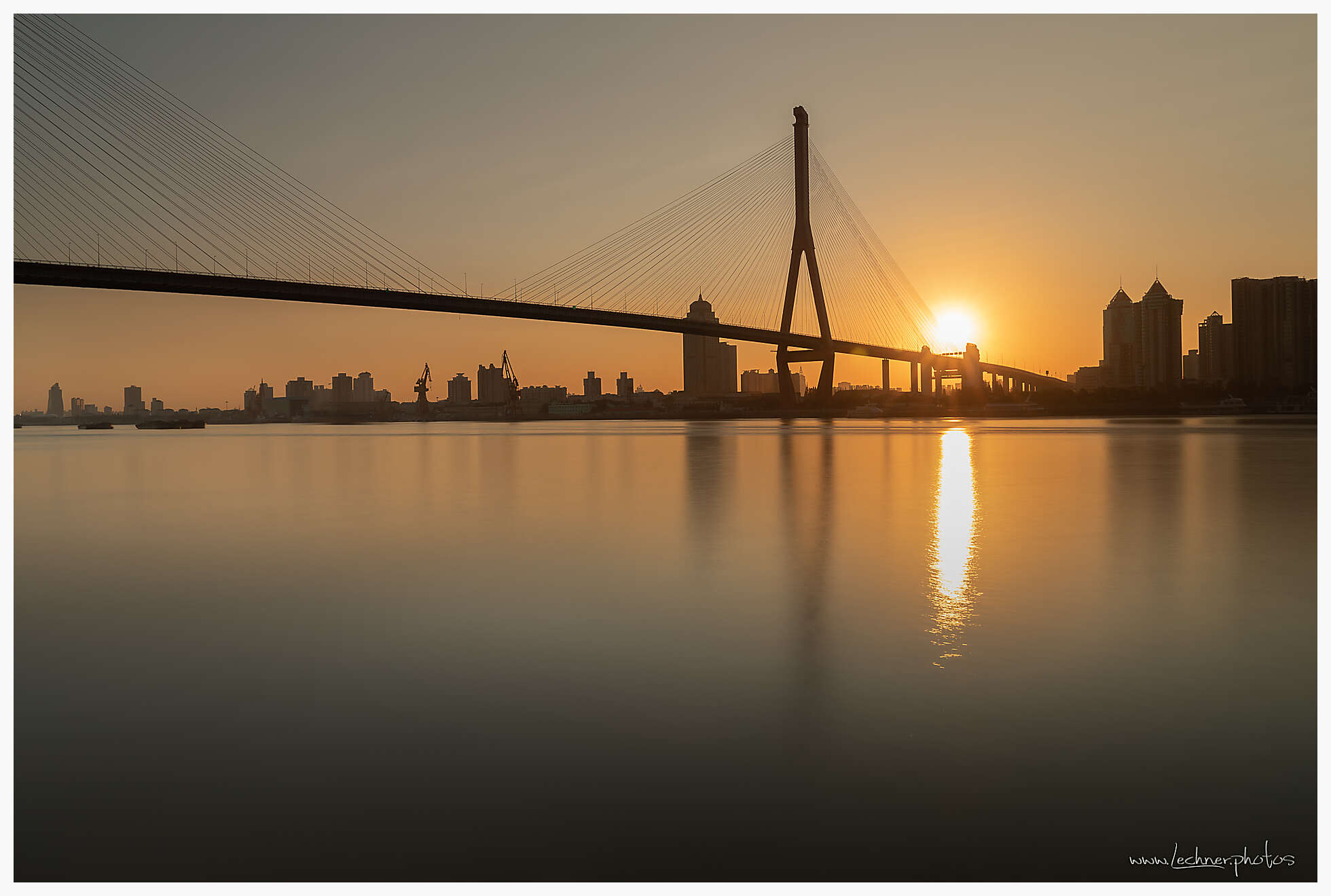 Sun rises over Yangpu Bridge